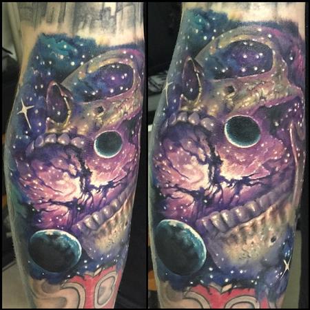 Evan Olin - Space and skull tattoo