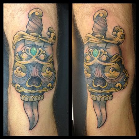 Tattoos - skull and dagger on a knee - 82324
