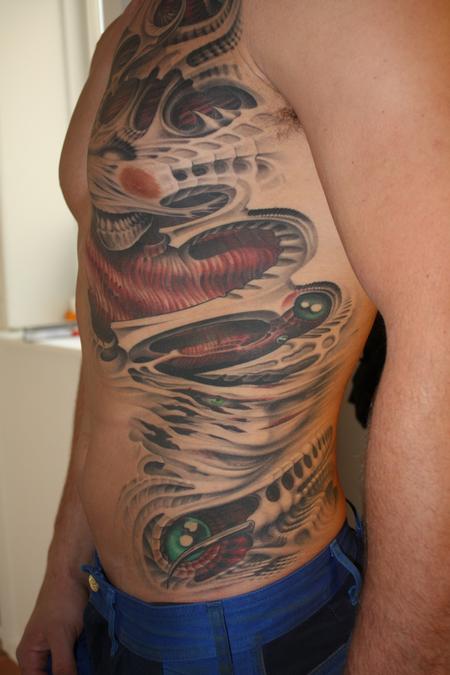 Tattoos - Evil bio-organic, faces hidden in flesh - 64234
