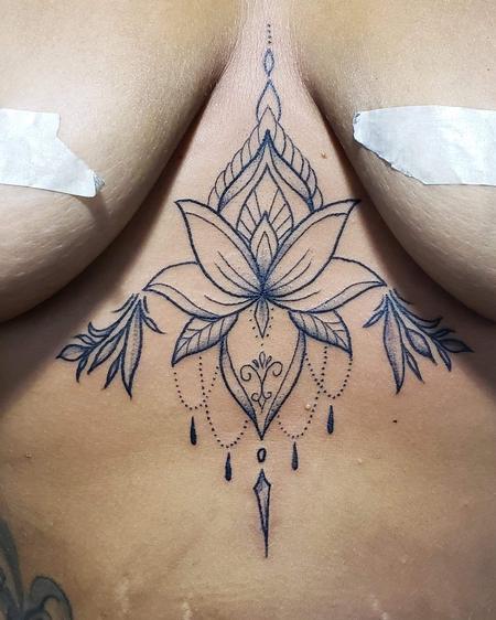 Blake Ohrt - Lotus line work tattoo on sternum chest