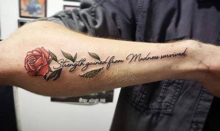 Blake Ohrt - Rose with script tattoo