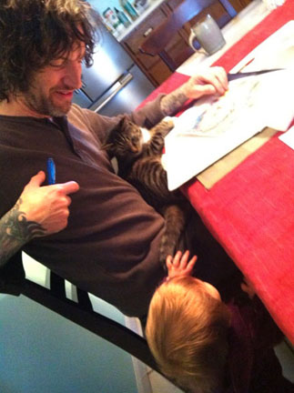 Guy drawing with Kitten and Kaia, 2012