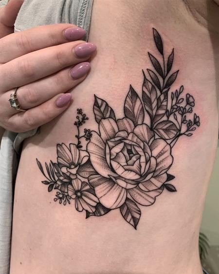 Hector Concepcion - Floral tattoo on ribs